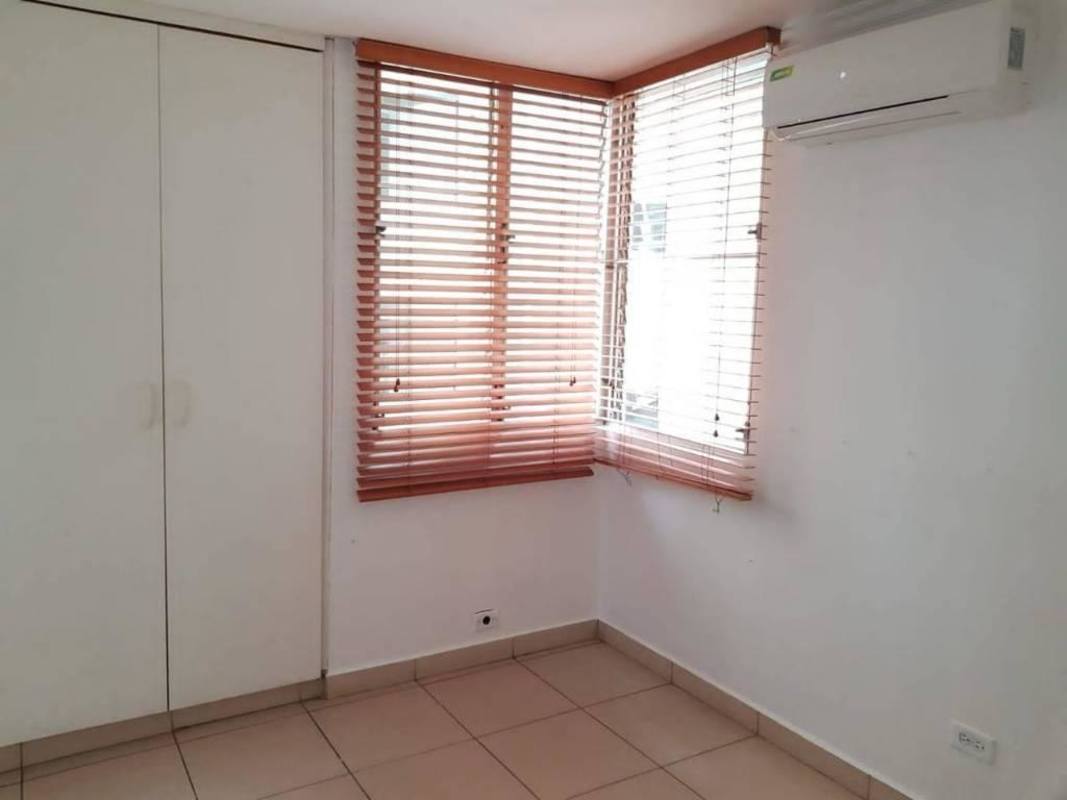 Entrance hallway with sofa cream walls tile flooring PH Nuova Villa Tumba Muerto Panama