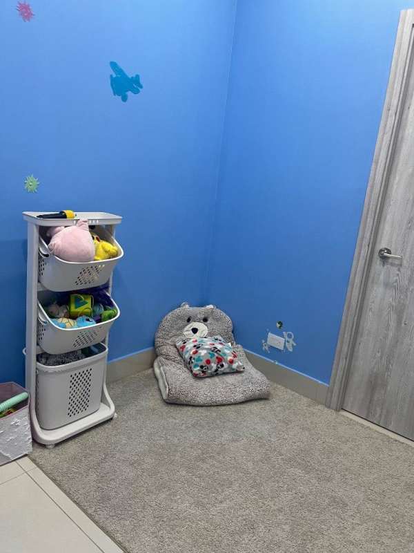 Children's room with toys, blue walls decor perfect for pediatric therapists Costa del Este Panama