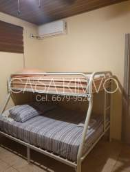 Bedroom with 2 bunk beds and AC unit at Casa Kimvo Nueva Gorgona Playa Malibu Panama