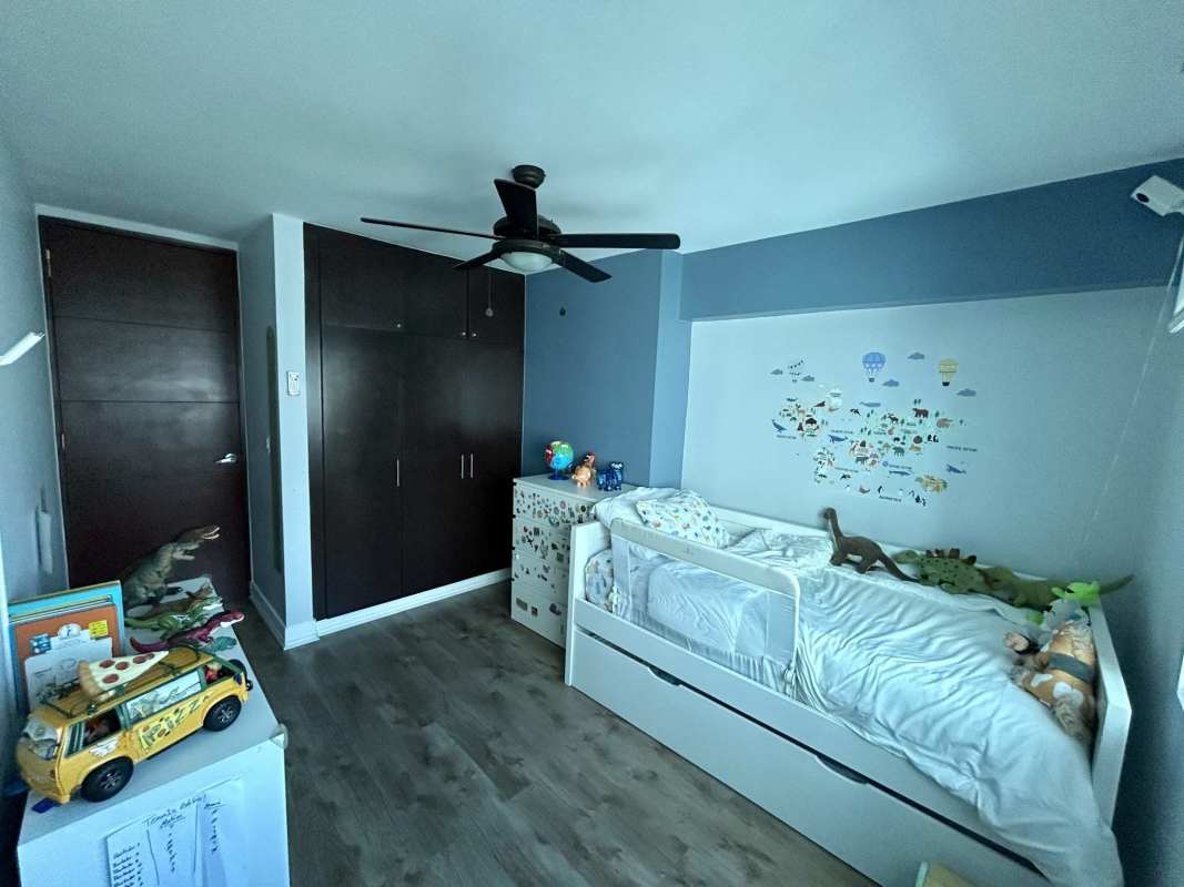 Children's room with wall decals, wood floors, closet in PH San Francisco Bay Panama City