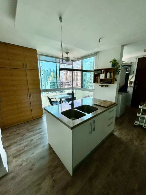 Kitchen with granite countertops, island, stainless appliances at PH San Francisco Bay