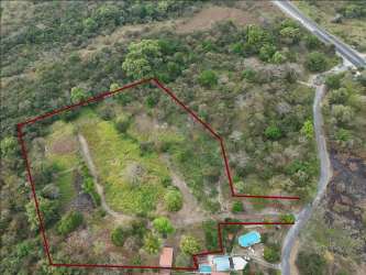 Drone image showing tree-bordered property lines near Pacific coast Panama