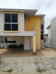 Exterior view two-story modern house with balcony in Santillana Residencial Sector Arraijan Panama