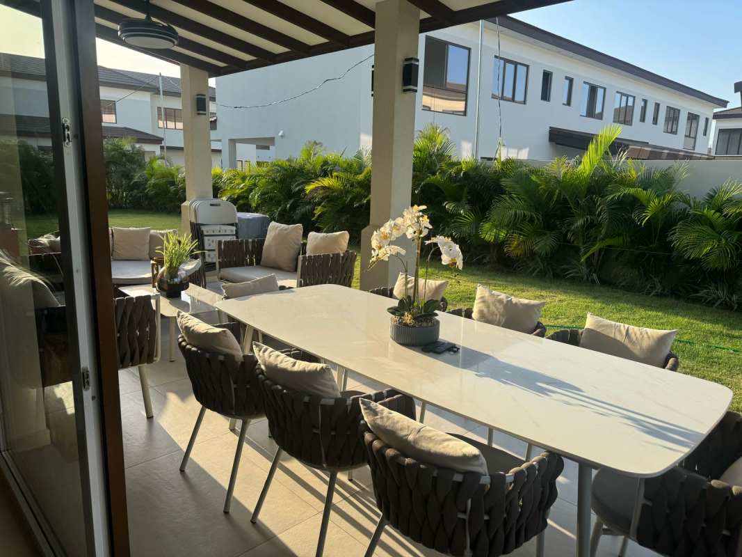 Bright open plan living dining space large windows in Santa Maria Golf Panama