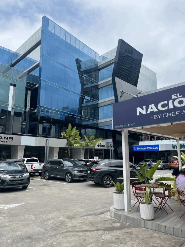 Multi-story commercial plaza with reflective glass and parking in Punta Pacifica Panama City