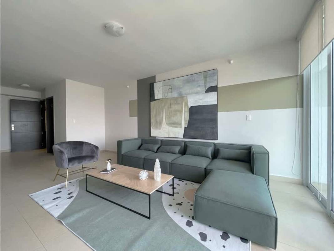 Contemporary living space with stylish sofa, wall art, large windows in Costa del Este PH Country Club