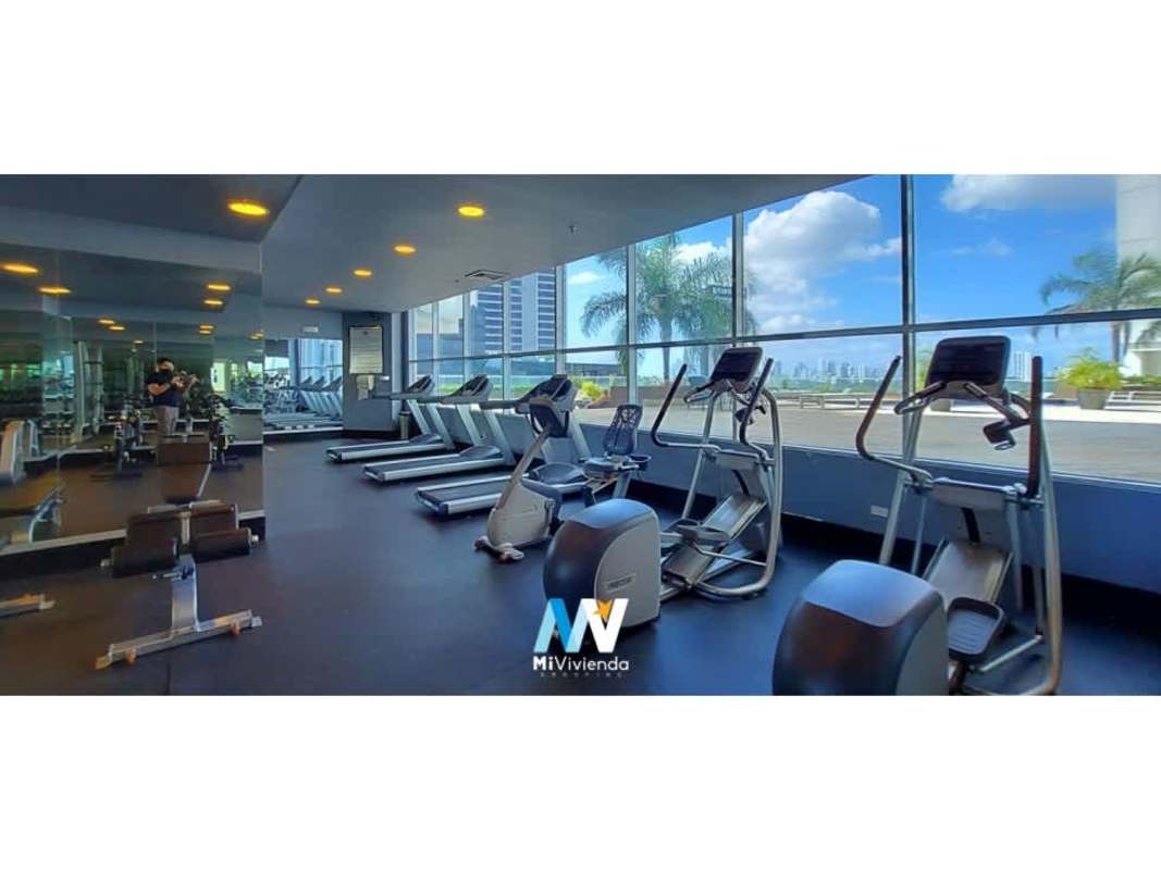 Gym with cardio equipment and panoramic city skyline view at PH Country Club Costa del Este Panama