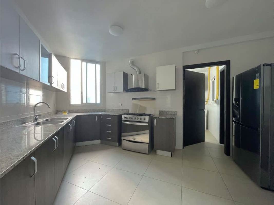 Spacious furnished bedroom with large windows and city views in PH Country Club Panama