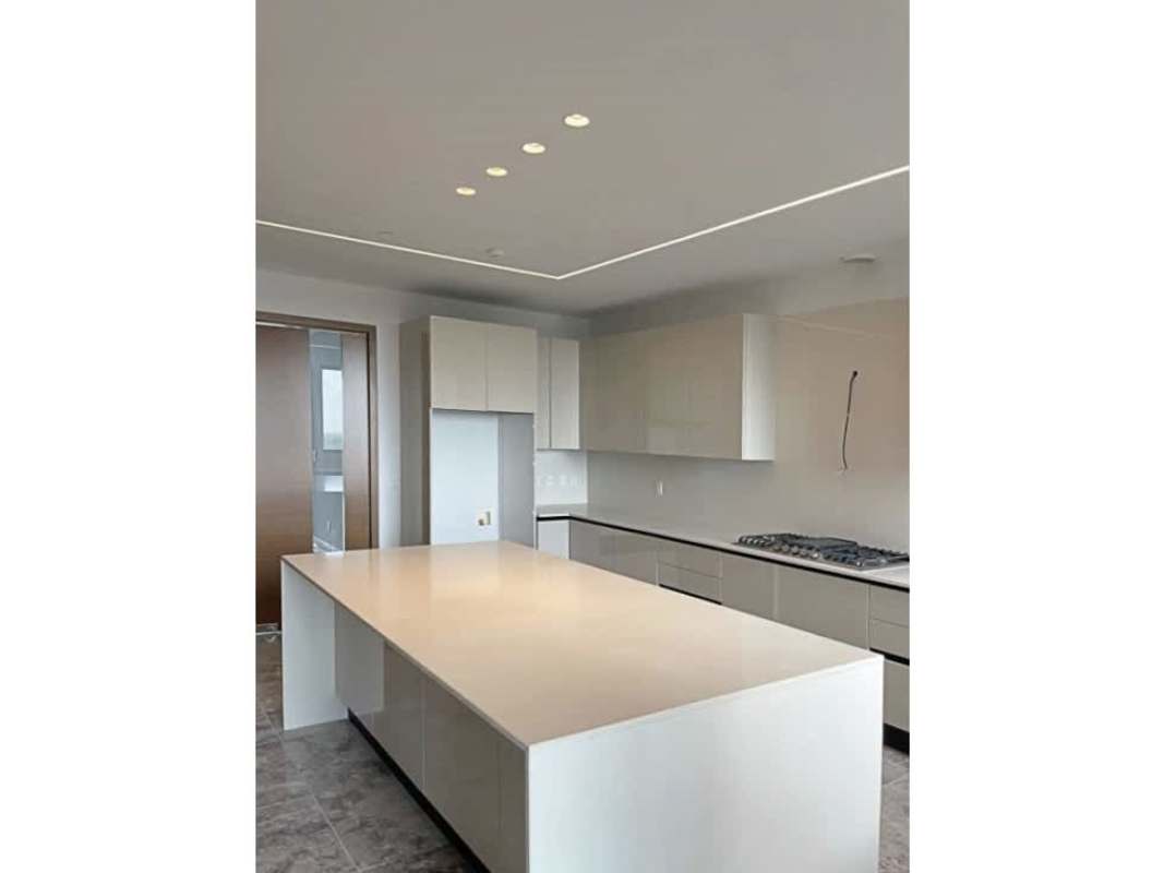 Bright open living room with marble flooring, floor-to-ceiling windows and balcony at Empire Residences Santa María Panama