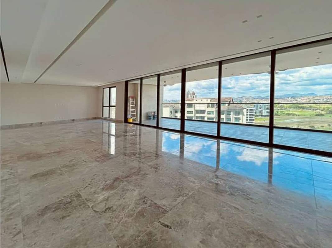 Spacious modern kitchen with island, quartz counters, sleek cabinetry in Empire Residences Santa María Panama