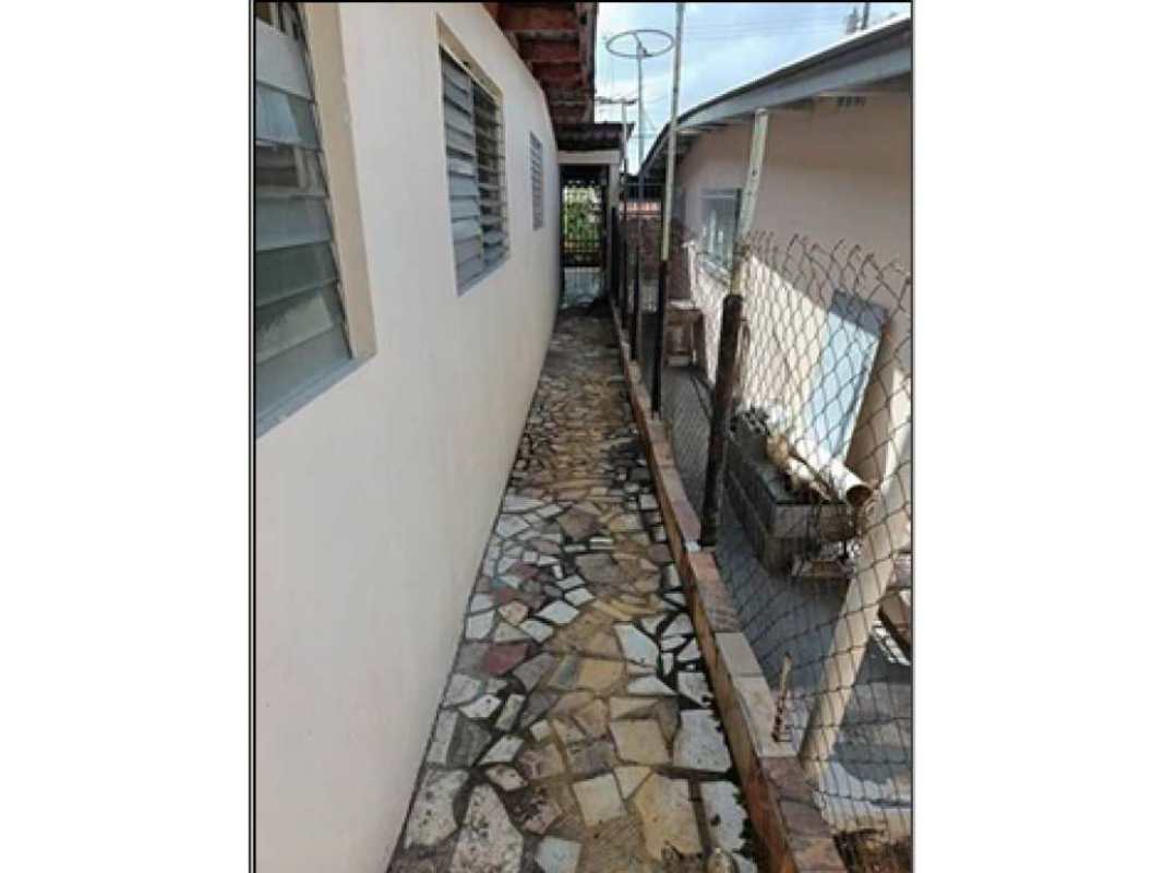 Exterior covered terrace with brick pattern wall in residential house Panama