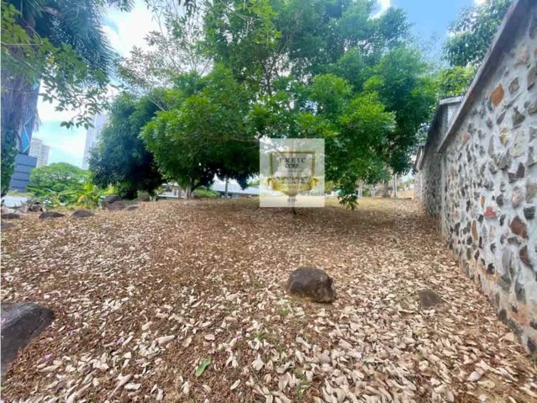 Vacant sloped buildable corner lot with trees in La Cresta residential area Panama City