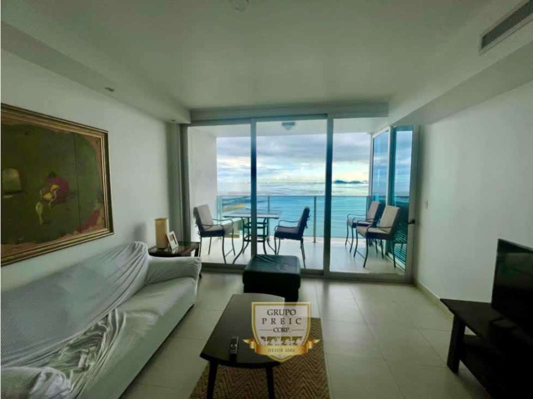 Modern living room with floor-to-ceiling windows balcony Pacific ocean view PH Waters on the Bay