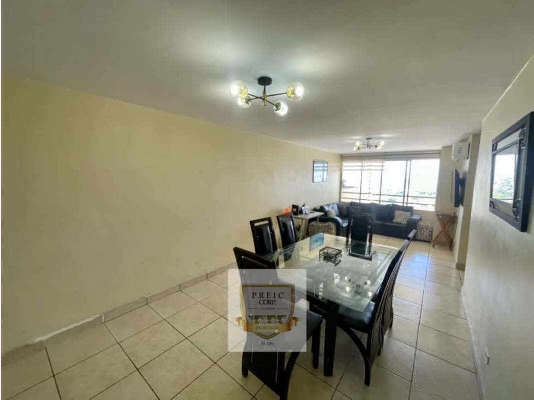 Modern beige high-rise residential tower Victoria Hills with balconies Panama City