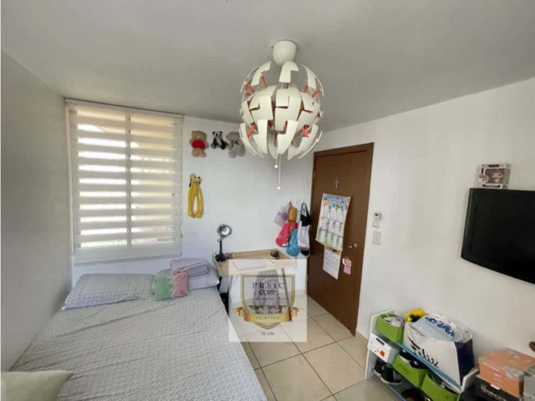 Bedroom with blue accent wall flat TV tile flooring modern lighting PH Victoria Hills Hato Pintado Panama