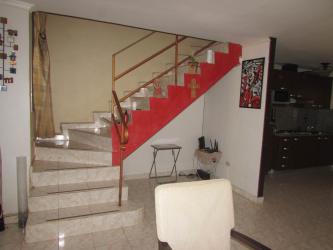 Kitchen with cabinets, appliances and dining area in house in Vista Alegre Arraiján