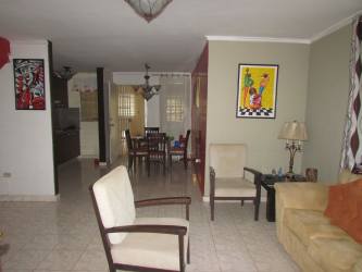 Spacious bright living area with tile floor and ceiling fan in house at Residencial La Estancia Panama