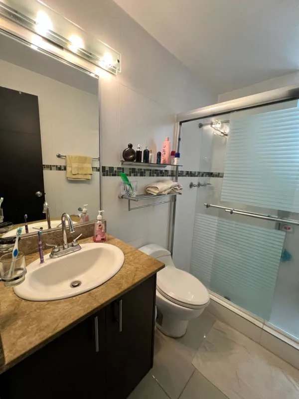 Bathroom modern marble countertop glass enclosure frosted design Panama City apartment Hato Pintado Tower