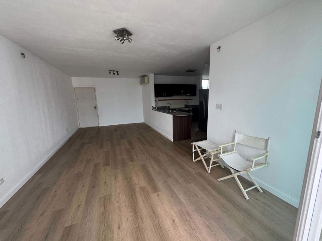 Open living dining space with balcony and skyline views in PH Kubic El Cangrejo Panama City