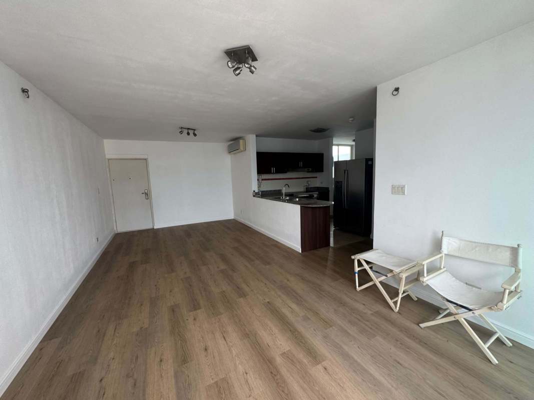 Modern kitchen with granite countertops, wood cabinets, stainless appliances in PH Kubic Panama