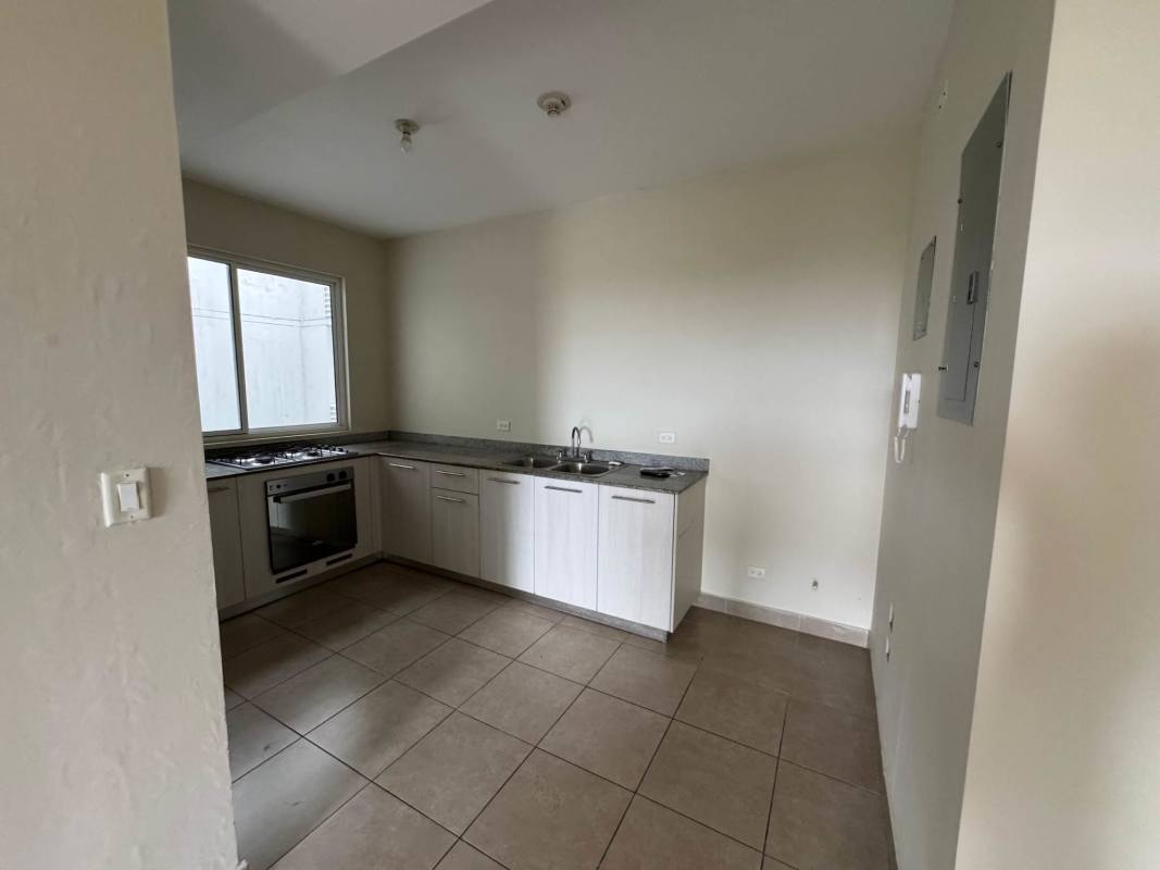 Covered balcony overlooking garden and residential area Las Acacias Panama City