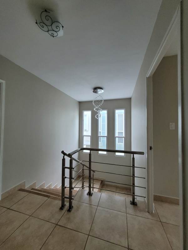 Living room and dining area fully furnished with tile floors and AC in San Miguelito