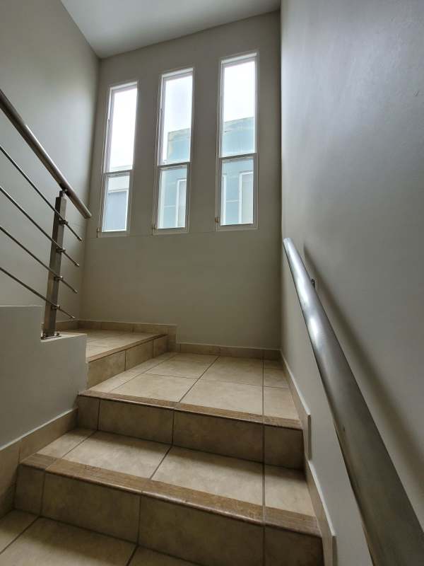 Bathroom with granite, glass shower and modern fixtures in furnished house San Miguelito