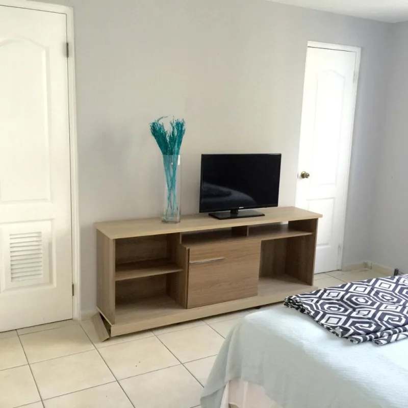 Spacious bright master bedroom featuring TV stand and built-in storage at PH San Francisco Tower Panama