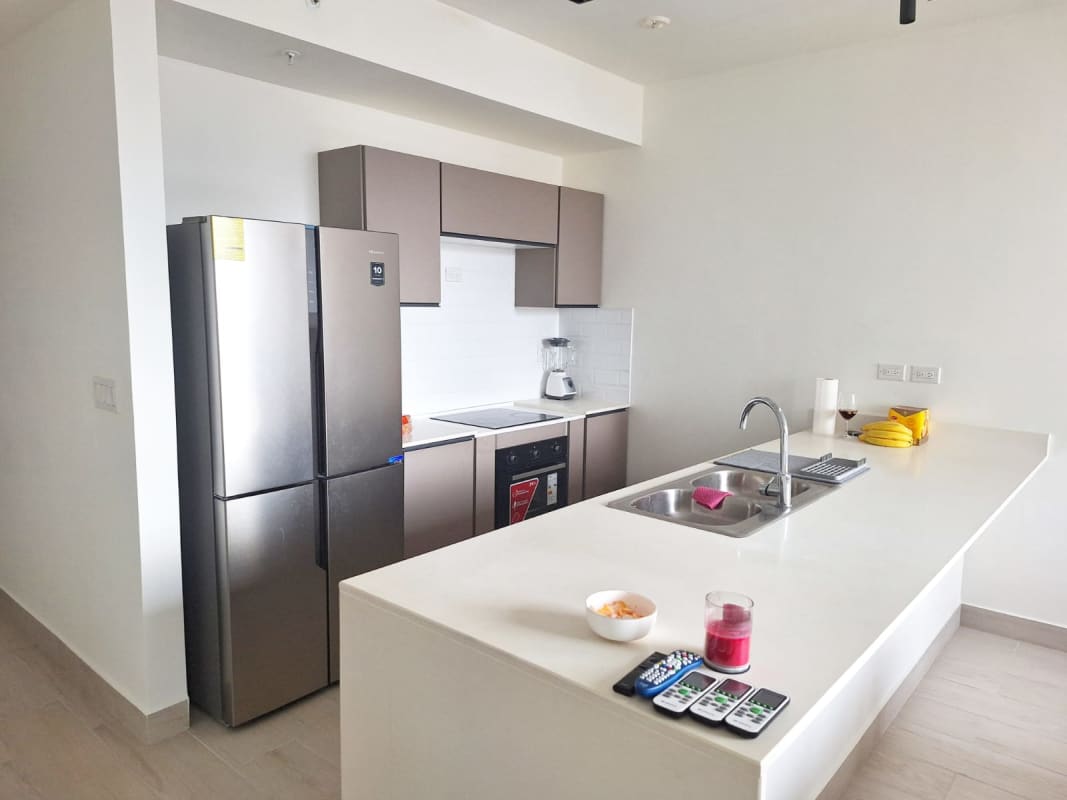 Modern kitchen with granite counters and appliances PH Urbana Obarrio Panama furnished rental