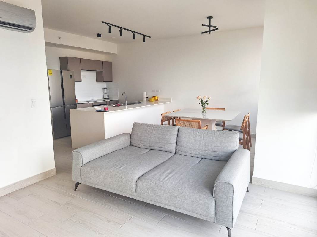 Bedroom with large window, city views, AC in PH Urbana Obarrio furnished apartment Panama City