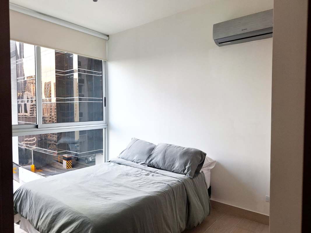 Bedroom with floor-to-ceiling window, AC, city view in PH Urbana Obarrio Panama