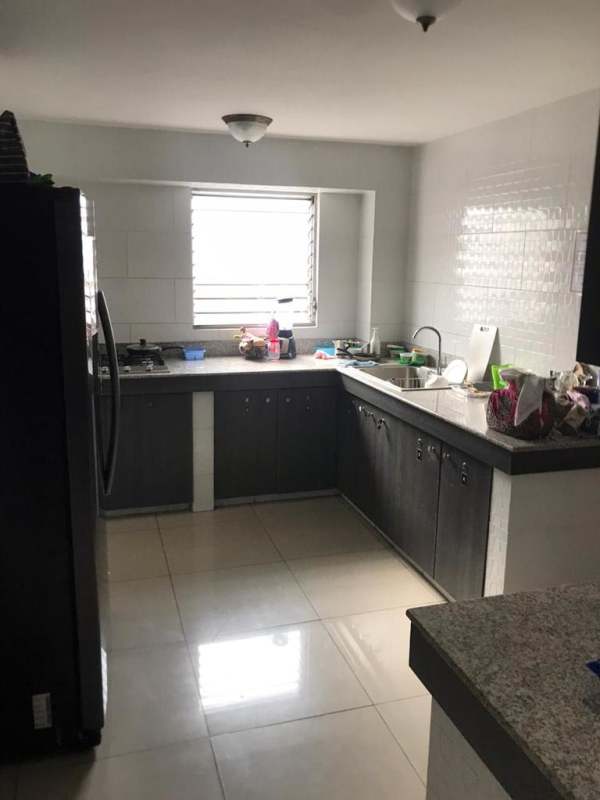 Laundry area with washer and dryer in shared apartment steps from University Panama