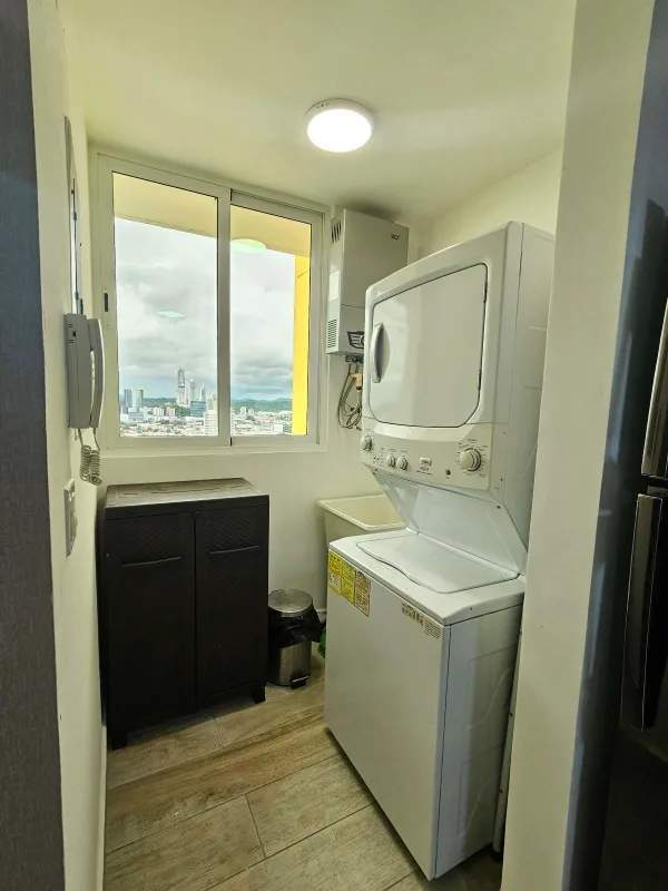Laundry room with large window, washer/dryer, storage in PH Vista Hermosa Tower Panama City