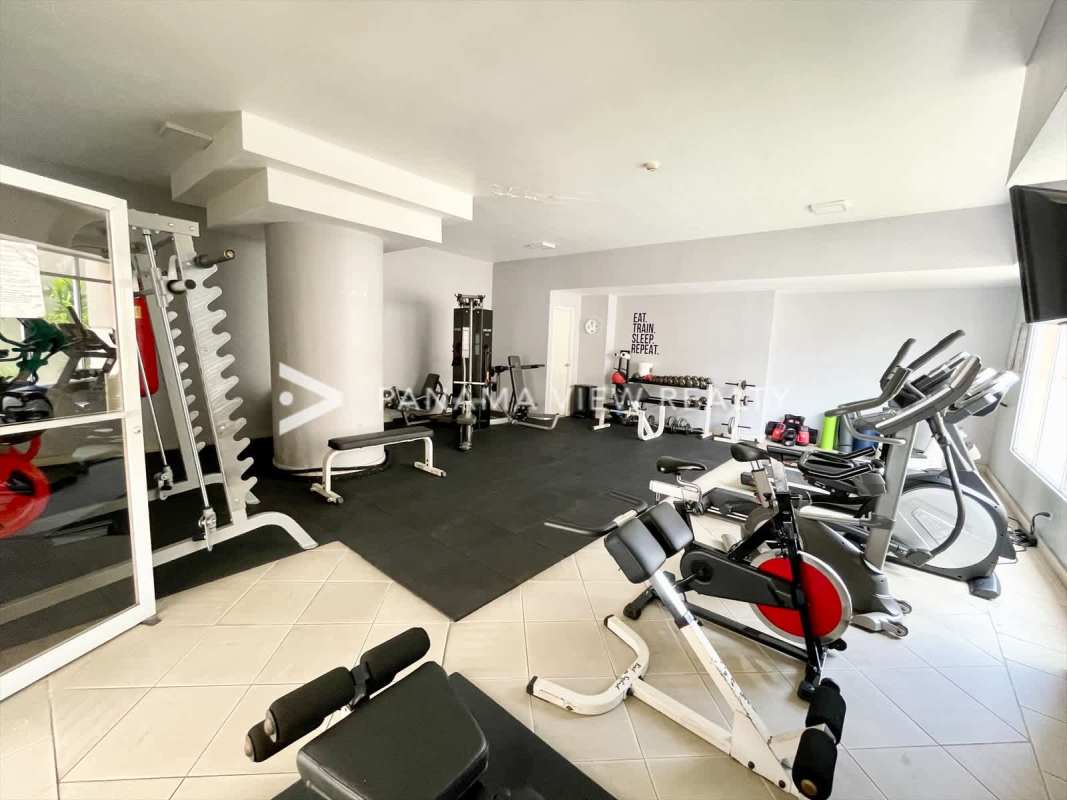 Outdoor swimming pool and city view social area at PH Victoria Tower Obarrio Panama