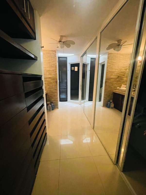 Modern bathroom with double sink granite countertop, large mirror in Dos Mares Panama house for rent