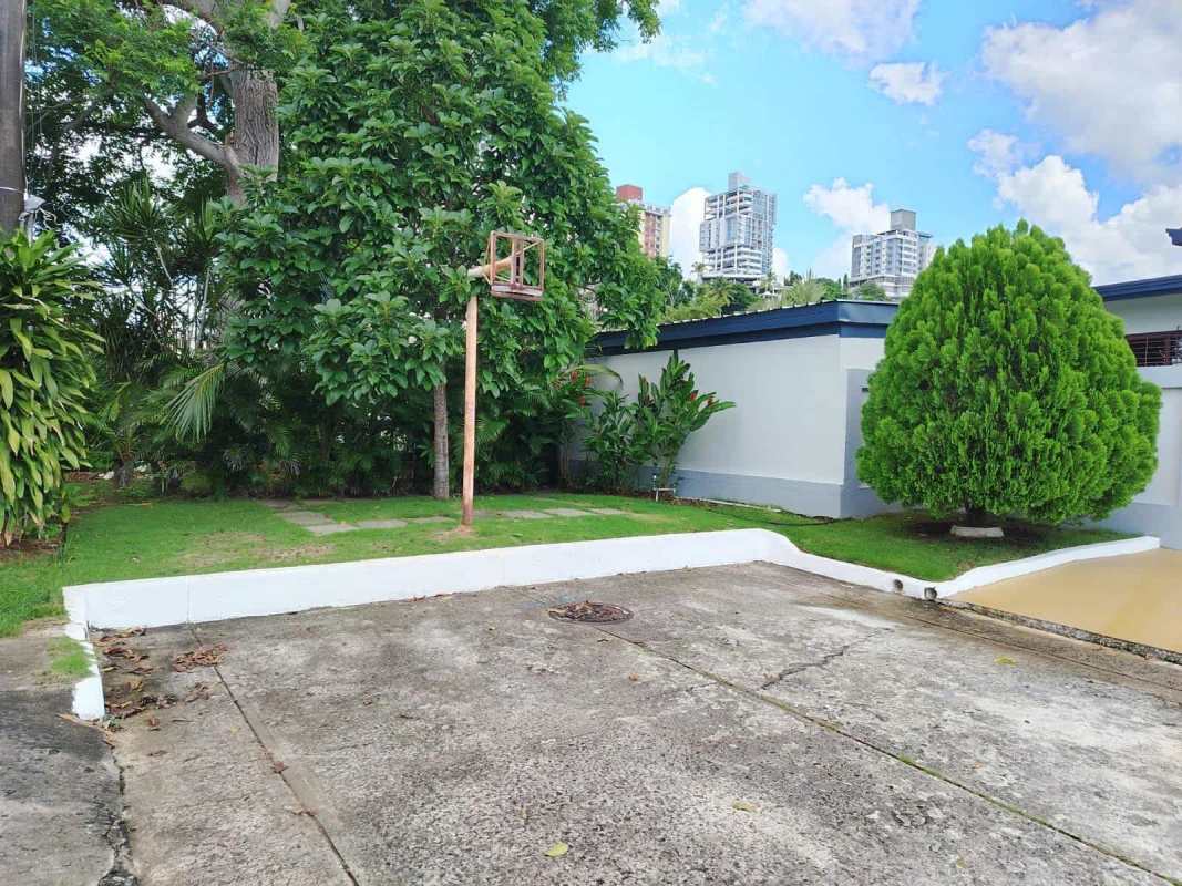Dining area with sliding glass doors to patio and garden at Betania house Panama