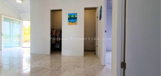 Master bedroom with ensuite bathroom and pool access in new Pedasí house