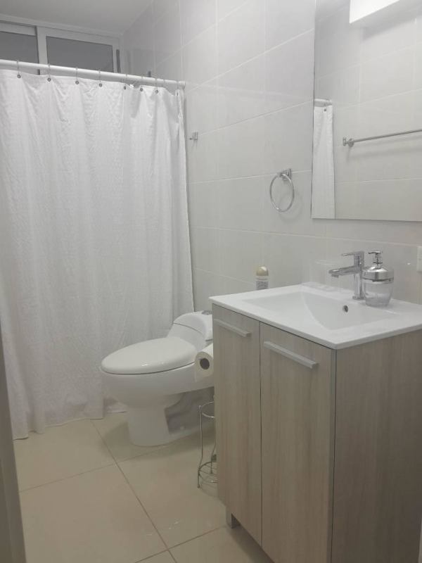 Bedroom with large windows, AC, ceiling fan and city view PH Coral Plaza Panama