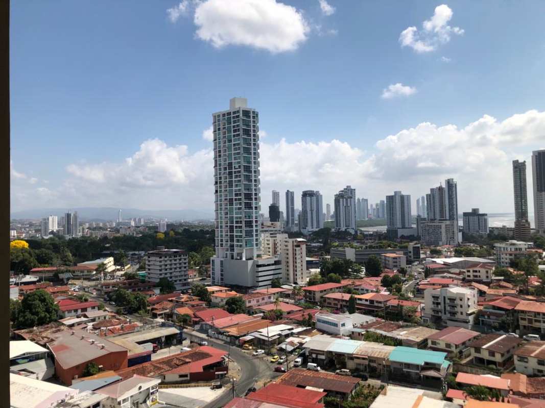 Open dining and living area with balcony city view in PH San Francisco Bay Panama