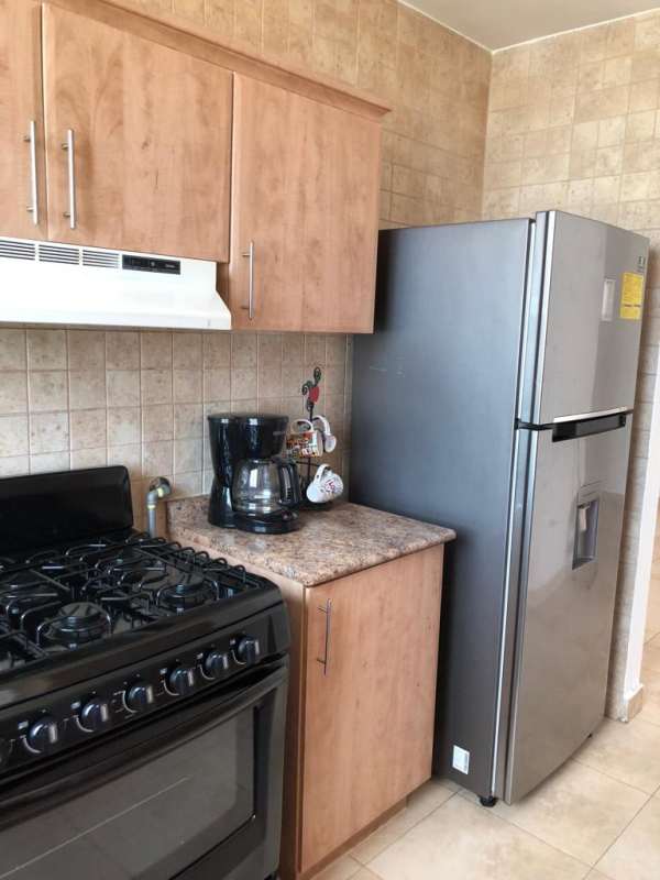 Laundry room with washer dryer unit in PH San Francisco Bay Panama City rental apartment