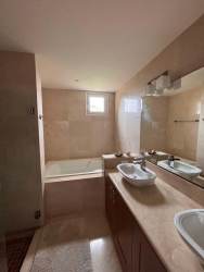 Open living dining area with large windows patio access luxury golf house Panama Pacifico