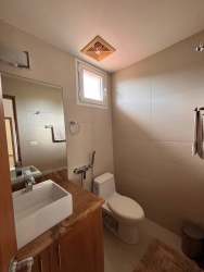 Contemporary bathroom with double sinks bathtub walk-in shower in luxury house Tucan Country Club Panama