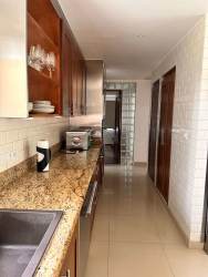 Contemporary kitchen with granite countertops wooden cabinets appliances in Tucan Country Club Panama