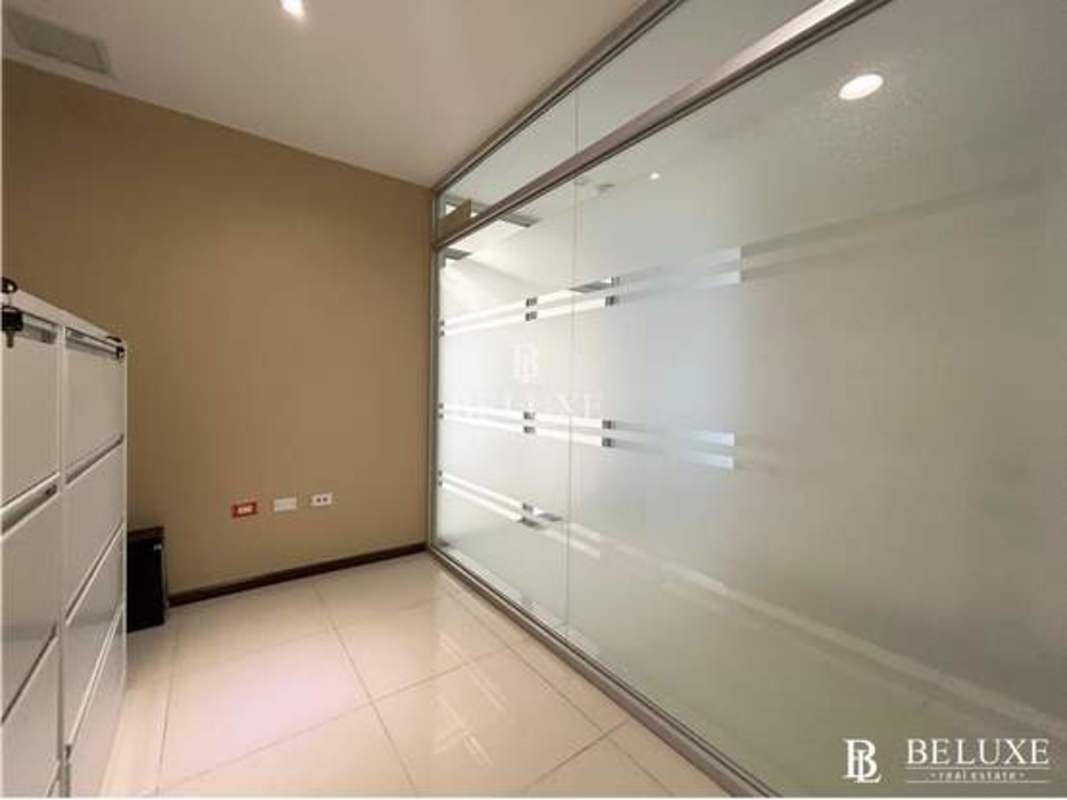 Small kitchenette with granite countertop and appliances in Oceania Business Plaza Punta Pacifica Panama