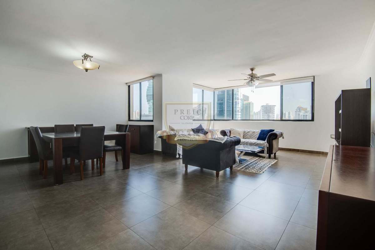 Contemporary kitchen featuring granite countertops, wood cabinetry and stainless appliances in luxury Marbella condo