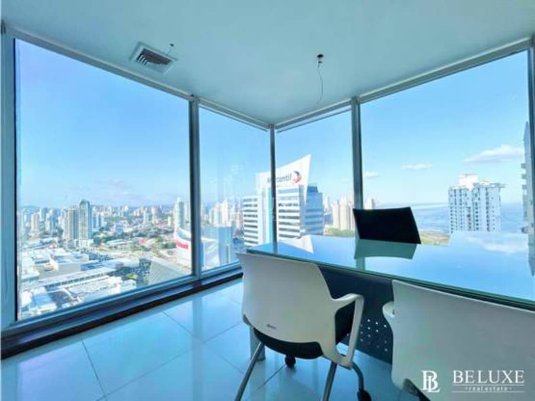 Corner office with floor-to-ceiling windows overlooking Panama Bay and skyline in PH Oceania Business Plaza