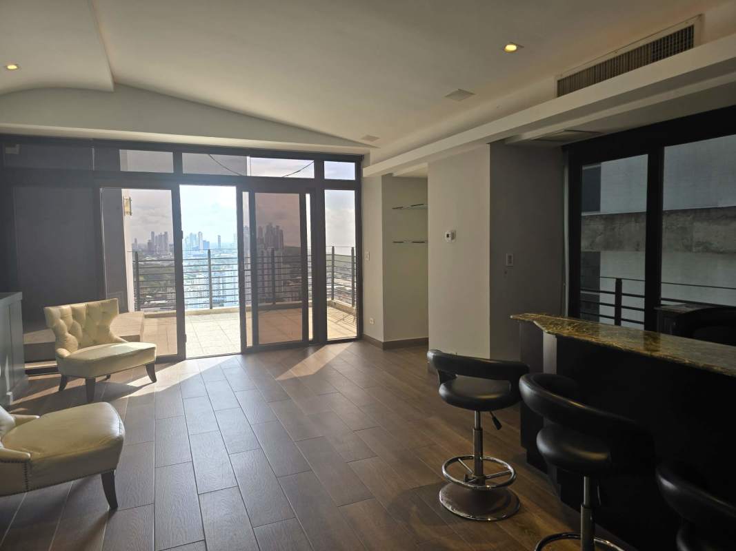 Luxury penthouse living room with bar, balcony access, park views PH Golf Tower Panama City