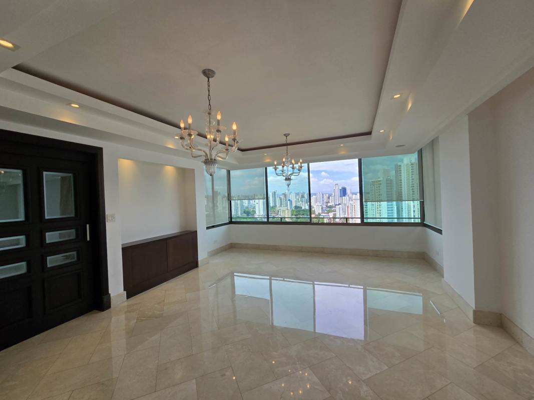 Front room with marble floor, floor-to-ceiling windows city views PH Golf Tower Panama