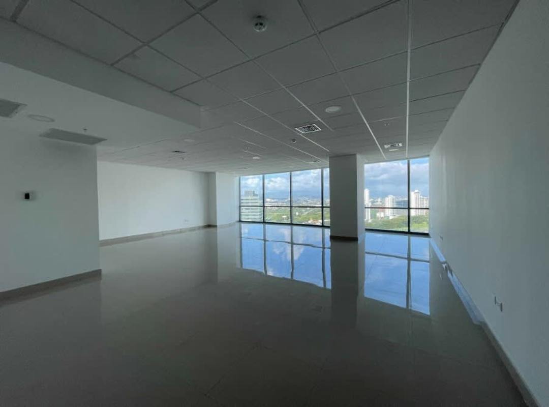 Empty section of office with large glass windows and city skyline view in Financial Park Costa del Este Panama