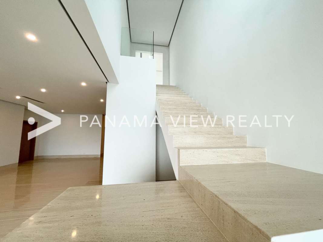 Spacious luxury bathroom with marble, dual sinks, glass enclosed shower in Ocean Reef penthouse Panama